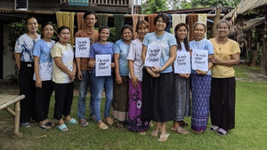A photo of handloom weaving artisans at Tohsang Cotton Village. Handmade clothes and fabrics are produced from sustainable cotton grown naturally and locally. 